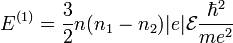 E^{(1)}=\frac{3}{2}n(n_1-n_2)|e|\mathcal{E}\frac{\hbar^2}{me^2}